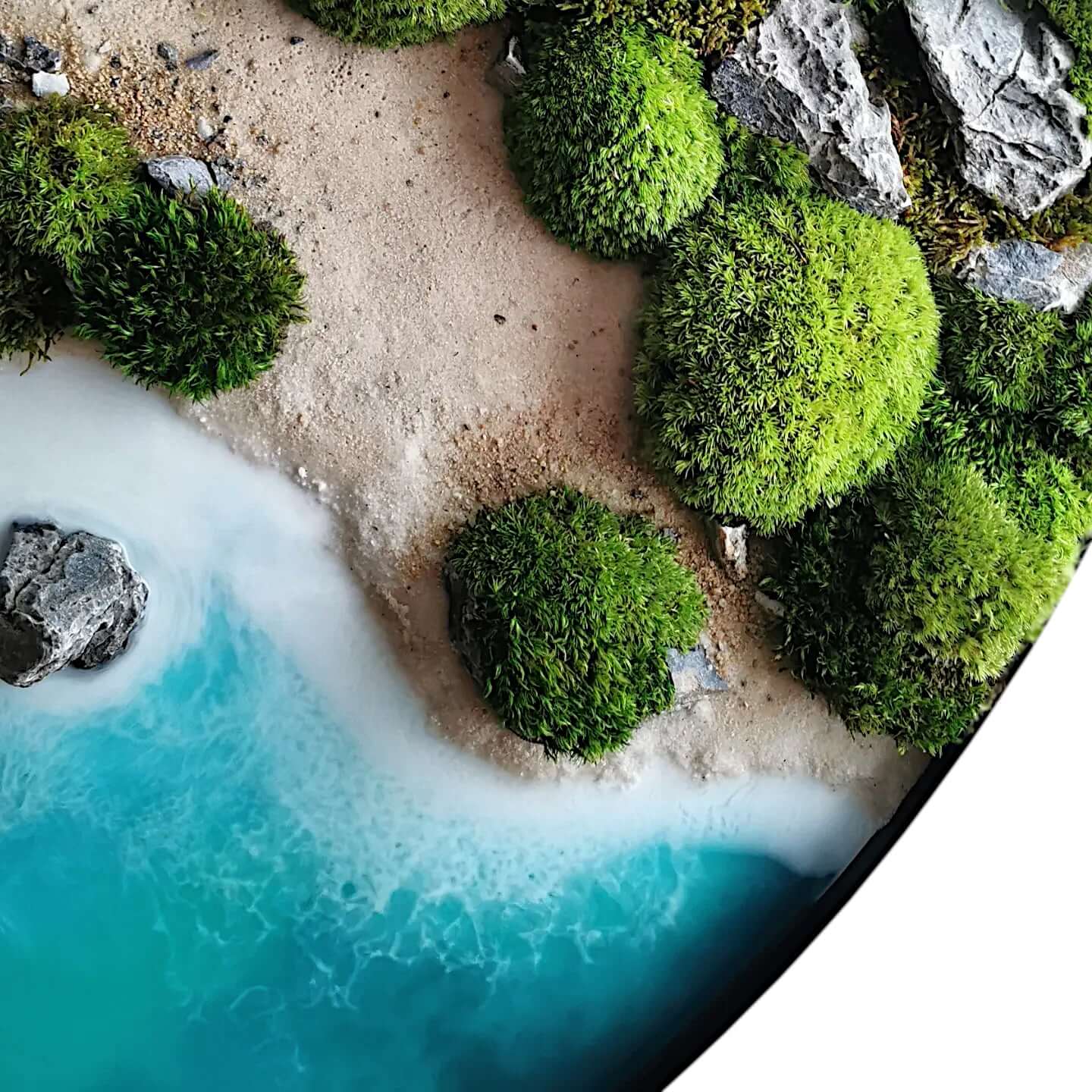 Handcrafted ocean art depicting New Zealand's coastline with green moss and sandy shore.