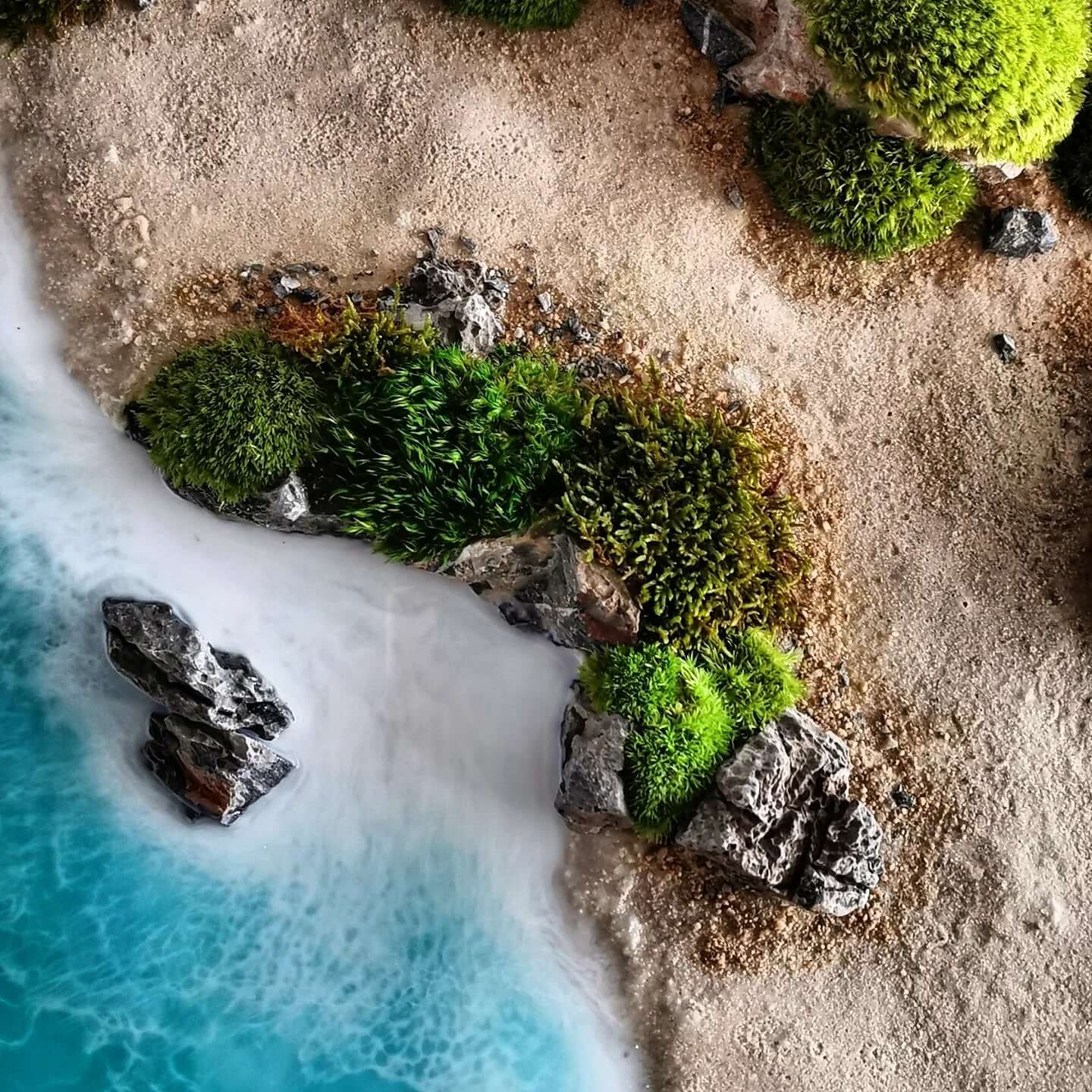Handcrafted ocean scene with real stones and preserved moss, inspired by New Zealand's stunning coastline.