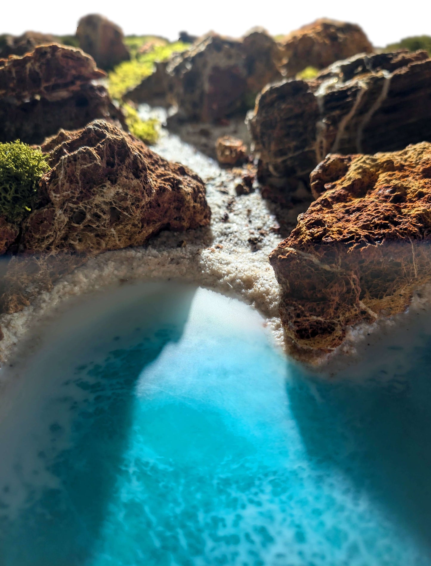 Handcrafted wall art featuring coastal Algarve landscape with preserved moss, rocks, and resin in vibrant blue tones.